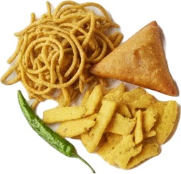 a plate of food with some chips and a bowl of sauce.jpg